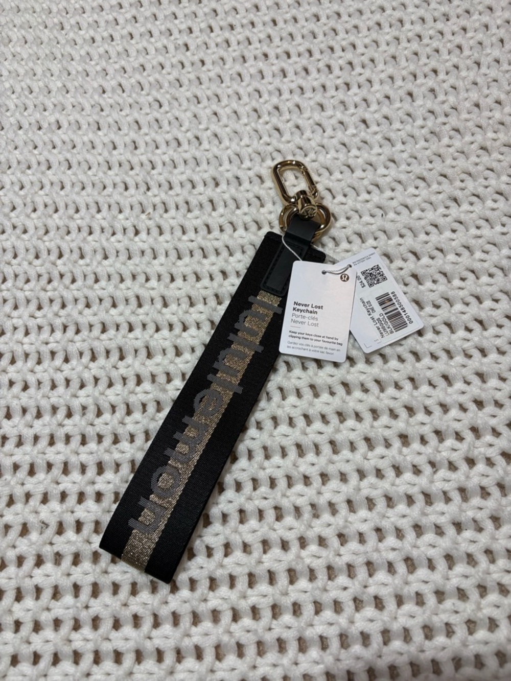 NWT lululemon black & gold never lost keychain